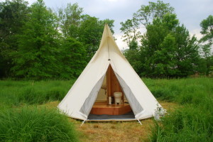 TipiBath™ You have never experienced anything like our handcrafted shower tent TipiBath™ (yes, a full tent bathroom rental inside a glam camping teepee!). Traditional unsightly portable event restrooms belong hidden, the TipiBath™ begs to be part of your event aesthetic with its elegant canvas shape and red cedar interior. This bathroom and shower tent is one of our best tents to add a memorable touch. Guests and clients find the TipiBath™ to be a decorative novelty and an elegant merge of function and form. It is a very stylish alternative to traditional portable restrooms with its ceramic, cedar and canvas decorative features.